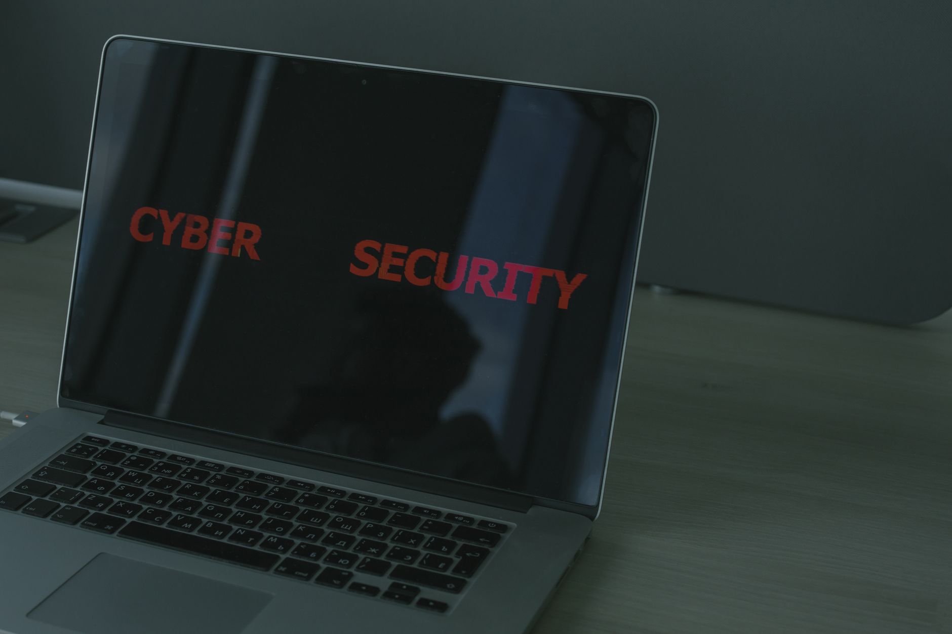 Laptop displaying cybersecurity text