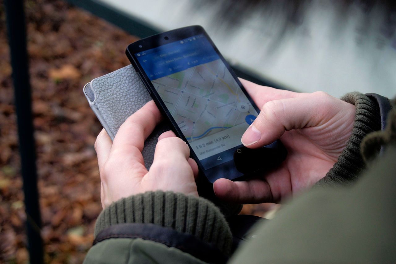 Person using a map app on a smartphone